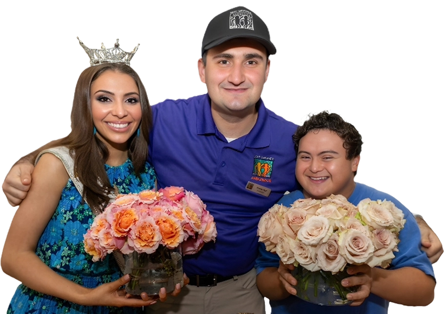 Miss Florida is seen with two male Best Buddies program participants holding roses.